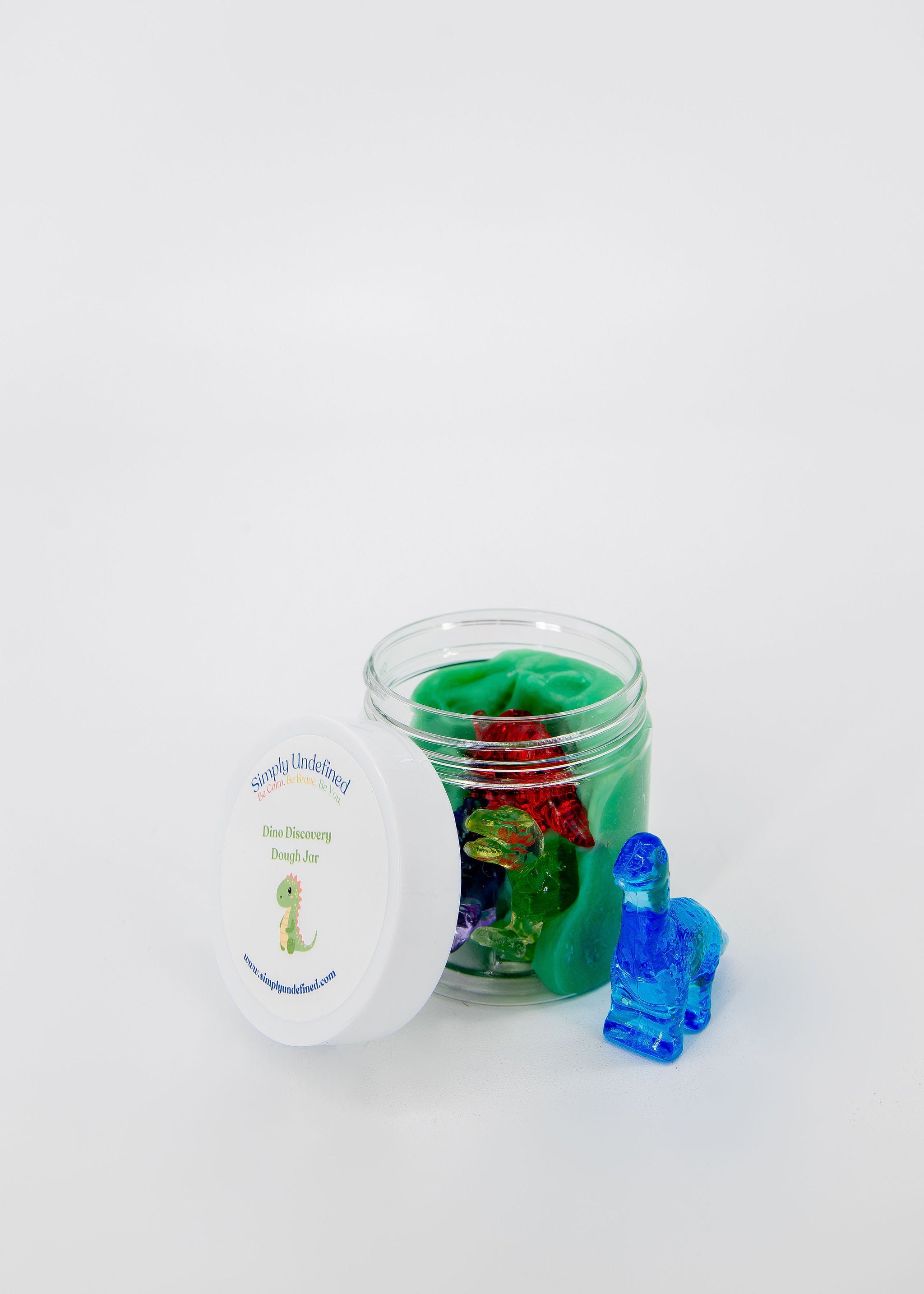 Dino Discovery sensory jar for kids with green dough and dinosaur figures