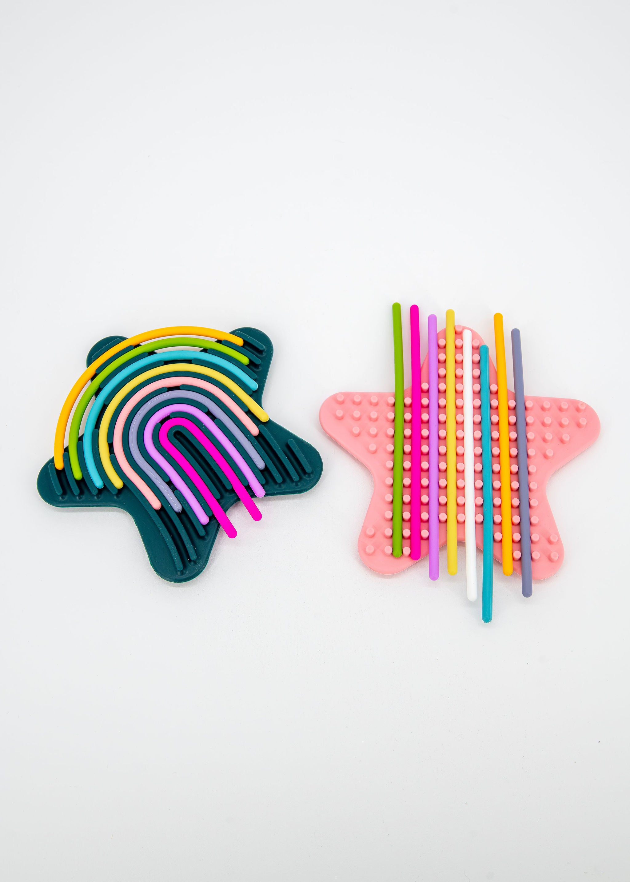 Colorful lacing noodles included with silicone sensory activity board
